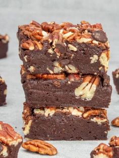 several pieces of brownie with pecans on top