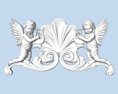 two cherubs with wings on a decorative plaque