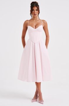 Make an entrance in Mariella. the party midi of your dreams this season. Super feminine and chic. this dress is truly an icon with a structured. corseted bodice that's boned to cinch your waist and contrasted by a full. voluminous skirt.   Colour: Blush. Non stretch cotton blend fabric. Fully lined. Corseted bodice that's boned to cinch your waist. Super full. voluminous skirt. Lace up back. Adjustable straps. Invisible zipper. Midi length. Model is an XS and is wearing an XS. Homecoming Dresses Corset, Midi Dress Wedding Guest, Long Sleeve Homecoming Dresses, Voluminous Skirt, Split Long Dress, Homecoming Dresses Long, Maxi Dress Sale, Sparkle Dress, Dresses By Length