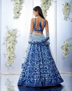 This blue lehenga set features intricate resham embroidery on softest tulle. The outfit is paired with a v-neck blouse and with a four-sided embroidered net dupatta.From Seema Gujral's Tuscan Summer collection. DELIVERY TIMEPlease allow 8-12 weeks for your outfit to arrive. FABRIC DETAILSNet Professional cleaning only. Seema Gujral, Resham Embroidery, Resham Work, Work Lehenga, Blue Lehenga, Indian Dresses Traditional, Embroidered Lehenga, Blue Embroidery, Net Dupatta