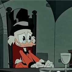 a cartoon character sitting at a dinner table