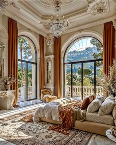 an ornate bedroom with large windows overlooking the mountains