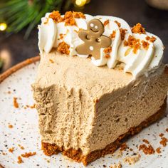 a piece of pie with white frosting and ginger spice toppings on a plate