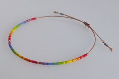 🏳️ ☆ ☆LGBTQ bracelet☆ ☆ ☆🏳️🌈 These beautiful and minimalist bracelet is made of delicate and high quality Miyuki beads. It represents the Pride flag and is perfect for any outfit. It's unisex, so anyone can wear it. Thanks to macrame slide knot it is easily adjustable and should be fit for most adults and also teens wrists, but please, don't hesitate to text me if You think You need a smaller or bigger one. It's about 14-15 cm when fully tightened and about 25 cm when expanded. ☆ ☆ ☆Waterproo Lgbtq Bracelet, Bracelet Miyuki, Bracelet Rainbow, Pride Bracelet, Miyuki Bracelet, Bohemian Accessories, Minimalist Bracelet, Miyuki Beads, Pride Flag