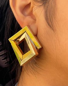 Transform your look with our captivating statement earrings - a unique pair that embodies boldness, trendiness, and modern sophistication. These dramatic dangle earrings, adorned with chic geometric designs in timeless gold, are the perfect gift, blending vintage allure with contemporary elegance, and adding a touch of glamour to any occasion *FEATURES* - Size: 5.1cm x 4.5cm - Weight: 20.7g - 100% Hypoallergenic - Lead and nickel free  - Comes with jewelry box and pouch - Tarnish free - Free delivery *CARE* - Please avoid exposing your jewelry to water. - Keep them away from any oils, lotions or perfumes. - Remove before working out and at bedtime. *SHIPPING* Order Processing: Orders are shipped out same day if ordered before 2pm EST. Orders after 2pm EST are shipped the next day.  Standar Modern Clip-on Earrings For Party, Modern Clip-on Party Earrings, Modern Party Clip-on Earrings, Yellow Metal Drop Earrings, Gold Geometric Earrings For Party, Geometric Gold Earrings For Party, Modern Yellow Earrings For Party, Modern Yellow Single Earring, Unique Yellow Earrings For Party