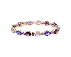 Infuse your style with sparkle as you wear this bracelet featuring gorgeous cushion- and oval-cut amethyst and rhodolite stones. The timeless gleam of the 14k yellow gold design completes the luxurious effect. Elegant Purple Gemstone Bracelets, Blue Nile, Elegant Amethyst Bracelets With Gemstone Accents, Elegant Oval Bracelets With Gemstone Accents, Luxury Oval Stone Bracelets, Luxury Oval Bracelets With Stones, True Winter, Garnet Bracelet, Rhodolite Garnet