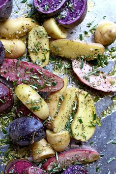 potatoes and beets with herbs on a sheet of tin foil, ready to be cooked