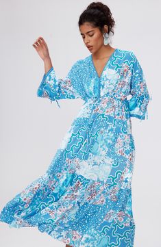 A mix of lively prints joyfully animates this airy, lightweight midi dress that bops to a boho beat. Slips on over head V-neck Three-quarter sleeves 100% viscose Dry clean Imported Bohemian Midi Dress For Daywear, Patterned Midi Dress With Vibrant Print For Vacation, Patterned Vibrant Print Midi Dress For Beach, Patterned Floral Print Midi Dress For Beach, Bohemian V-neck Midi Dress With Vibrant Print, Bohemian Flowy Patterned Midi Dress, Bohemian Boho Print Midi Dress, Bohemian Viscose Midi Dress For Daywear, Bohemian Multicolor Print Dress For Spring