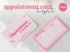 the appointment card is pink and white with stars on it, next to a flower