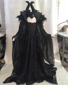 a black dress with feathers on it