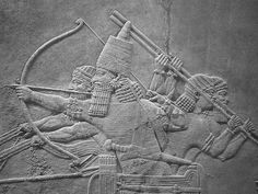 an ancient bask depicting two men with spears and arrows, one holding a bow