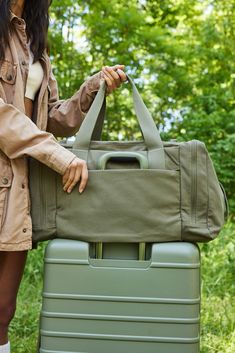 Discover our new utility tote bag in olive green. Perfect for work, travel, or everyday use, shop now for a durable travel tote bag designed to meet all your Practical Weekender Bag With Functional Pockets For Travel, Practical Weekender Bag For Travel With Functional Pockets, Sporty Travel Bag With Functional Pockets, Casual Duffle Bag With Luggage Sleeve For Overnight Trips, Functional Everyday Duffle Bag With Luggage Sleeve, Practical Duffle Bag With Functional Pockets For Everyday, Travel Duffle Bag With Functional Pockets, Functional Travel Duffle Bag With Pockets, Everyday Practical Duffle Bag With Functional Pockets