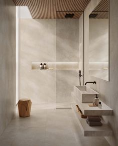 the bathroom is clean and ready for us to use in its new home, which has been designed with natural materials such as stone