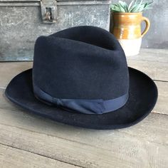 "Black Felt Homburg Fedora Hat 1910s, Paris by Tirard Freres Beautiful and genuine period mens hat. Gentleman's black felted Homburg fedora hat, black grosgrain silk ribbon band. Inner leather band has the gilded company logo and the silk inner lining has blue printed detailing with a heraldic crest for \"Tirard Freres\", \"Paris\". The \"Chapellerie Tirard\" worked between 1878 and 1956. Measures; approx. 21.75\" interior circumference, 7.75\" front to back and 6.25\" side to side. Hat is Not s Vintage Top Hat With Flat Brim, Vintage Formal Hat Bands, Vintage Formal Hat Bands In Solid Color, Formal Fitted Six-panel Hat, Vintage Fedora With Curved Brim For Formal Occasions, Vintage Wool Formal Hat, Vintage Wool Top Hat With Wide Brim, Vintage Wool Top Hat With Short Brim, Black Fitted Vintage Top Hat