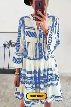 This Tribal Print Vacation Pleated Flared Sleeve Dress is a vibrant statement piece. With intricate tribal patterns adorning the fabric, its pleated design and flared sleeves exude a sense of playful elegance. Perfect for leisurely getaways, it embodies a fusion of cultural charm and contemporary style. Long Sleeve Printed Mini Dress For Beach, Printed Mini Boho Dress For Vacation, White Printed Boho Dress For Summer, Printed Long Sleeve Boho Summer Dress, Summer Boho Long Sleeve Printed Dress, Printed Long Sleeve Mini Dress For Vacation, Long Sleeve Printed Boho Summer Dress, Long Sleeve Printed Mini Dress For Vacation, Summer Vacation Bell Sleeve Dresses