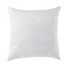 a white pillow with an embroidered design on the front and back, sitting on a white background