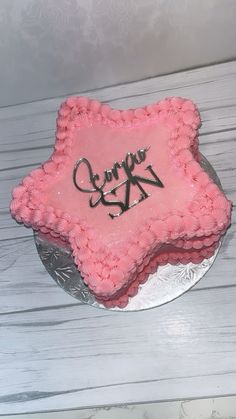 there is a pink cake that has the number twenty on it and some writing on it