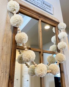 pom - poms are hanging from the front door