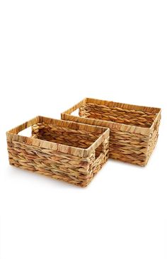 two wicker baskets sitting side by side