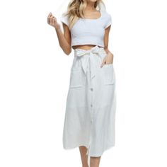 Linen Blend Ivory Paperbag Button Down Skirt Has Belt Hoops Around The Waist. Matching Long Linen Tie Belt. Built In Half-Slip. 70% Viscose, 30% Linen. High Waist Skirt With Buttoned Pockets For Summer, Chic Vacation Skirt With Pockets, White Button-up Bottoms For Vacation, Casual Summer Skirt With Buttoned Pockets, Button-up Beige Skirt For Summer, White Buttoned Midi Skirt, Casual Button Skirt For Vacation, Casual Beach Skirt With Button Closure, Summer Skirt With Pockets For Day Out