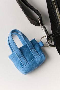 Add the cutest finish to your bags collection with this mini canvas bag keychain featured in a classic silhouette and structured design for a truly timeless touch. | Mini Caravan Bag Charm by Free People in Blue Crochet Mini Bag Keychain, Mini Pouch Keychain, Blue Bag With Interior Key Chain Holder For Gift, Rectangular Bag With Key Clip For Daily Use, Small Everyday Bags With Interior Key Chain Holder, Plush Craft, Mini Caravan, Tiny Bags, Crochet Mini Bag