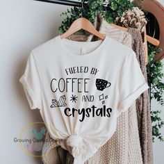 The perfect shirt for Coffee and Crystal lovers! Fueled By Coffee and Crystals Women or Teens Graphic Shirt. Coffee and Crystals Shirt, Crystals Shirt, Coffee Lover Shirt, Crystal Lover Shirt, Witchy Shirt, Crystals Gifts , Gift For Her, Spiritual. Cute witchy shirt for women. T- Shirt - * Soft Heather Bella Canvas Unisex T- Shirt. * Unisex sizing XS-3XL. * 52% airlume combed and ringspun cotton, 48% polyester.  * Black Heather and Athletic Heather is 90% airlume combed and ring-spun cotton, 10% Crystals Shirt, Witchy Shirt, Fueled By Coffee, Prism Color, Crystal Gifts, Graphic Shirt, Perfect Shirt, Graphic Shirts, Coffee Lover