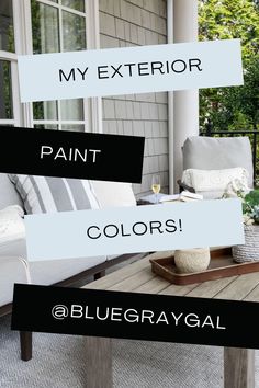 an outdoor patio with white furniture and black and white signs on the wall that read, my exterior paint colors @ bluesraygaal