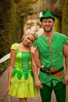 a man and woman dressed up as peter the neverlander and tinkerbell