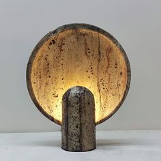 a table lamp that is made out of concrete