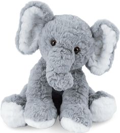 an elephant stuffed animal sitting on top of a white floor