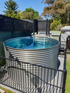 an above ground swimming pool in a backyard