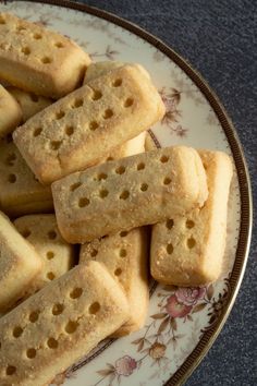 a plate full of short crackers sitting on top of a table