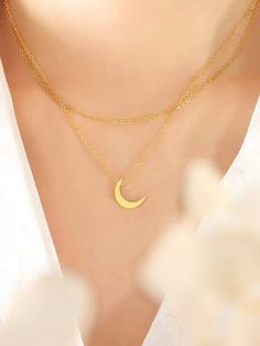 Sweet but right on-trend, this two-strand necklace features a small crescent new moon pendant for a celestial, magical vibe. The pendant and chains are titanium steel plated in 18k yellow gold. Layer this piece up with more chains or pendants for modern look, or embrace the simplicity of this necklace and let it pop all on its own for a radiant look. Perfect as a gift for a teenager or any person who can embrace their inner moon child! The moon pendant itself is approximately 1.3cm and the longe Elegant Layered Necklace With Moon Charm As Gift, Modern Minimal Jewelry, Silver Stacking Rings, Minimal Jewelry, Modern Necklaces, New Moon, Moon Pendant, Moon Necklace, Multi Strand Necklace