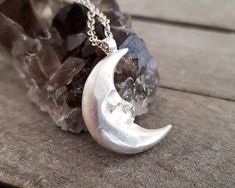 This celestial crescent resting moon pendant necklace is made by using the ancient lost wax technique and it is hand forged. It comes in a sterling silver chain of your choice or a waxed cord and the pendant is solid sterling silver made in great detail. A unique, ethereal piece of jewelry that will add character to any look and is ideal as a gift to yourself or to someone special. The total length of the chain is 460mm, please contact me if you would like me to custom made the length of your ch Flat Engagement Rings, Red Crystal Ring, Silver Moon Necklace, Fantasy Ring, Moon Necklace Silver, Raw Diamond Engagement Rings, Alternative Wedding Rings, Necklace Moon, Celestial Necklace