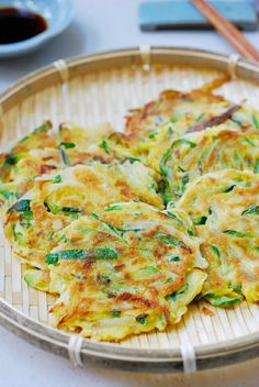 some food is sitting on a bamboo tray