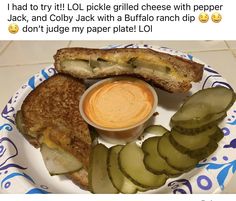 a plate with pickles and cheese on it