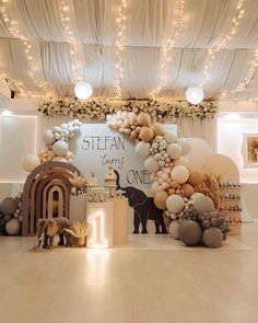 an animal themed birthday party with balloons and decorations