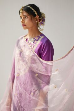 Purple three quarter sleeve straight fit kurta with sequin,cutdana embellishments in floral pattern. Paired with coordinating pant and blush pink dupatta. 
Component: 3
Pattern: Hand Embroidered 
Type Of Work: Cutdana,Sequin,Floral
Neckline: Round Neck
Sleeve Type: Three Quarter Sleeve
Fabric: Silk,Chanderi,Organza
Color: Purple
Other Details: 
Motif embellished dupatta
Loop trimmed kurta

Occasion: Puja,Mehendi and Haldi - Aza Fashions Kurta Set For Women, Kurta With Pants, Purple Silk, Kurta Set, Festival Wear, Set For Women, Three Quarter Sleeves, Quarter Sleeve, Aza Fashion