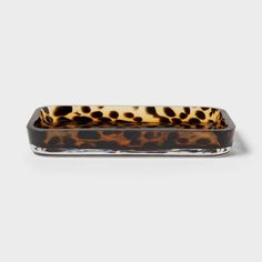 an animal print tray on a white background