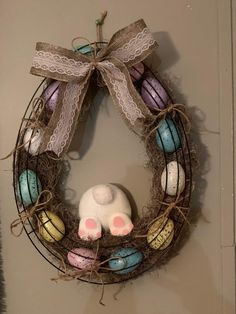 a wreath with an egg and bunny on it