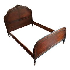 an old fashioned wooden bed frame with no headboard