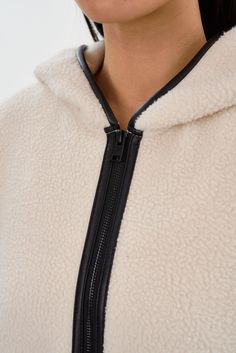 Wrap yourself in the cozy luxury of the ARLINA Polar Fleece Zip-Up Hoodie. Offering unmatched warmth and softness, the contrasting trim lends a touch of sophistication to its relaxed silhouette, making it a go-to for casual days. Perfect for layering, elevate your leisurewear or pair it with your favourite jeans and sneakers. Cozy Luxury, Leather Outerwear, Graphic Tee Dress, Teddy Jacket, Cardigan Sweater Dress, Anorak Jacket, Dress The Population, Front Bottoms, Leather Blazer