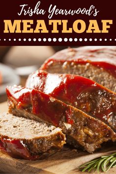 sliced meatloaf with ketchup on a cutting board