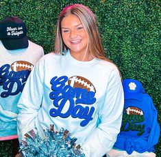 Be ready for game day with this sweatshirt! Featuring black glitter chenille, royal blue game day, and a football, it's perfect for football season and will match any school colors! So cute and comfortable, you need one of these for game days. Make football season even more fun with this sweatshirt! Unisex sizing and fit Size: Small - 3XL The sweatshirt is available in many different colors SPECIAL CARE - WASHING INSTRUCTIONS: Hand washing and air drying are always best for these items. Wash on delicate, cold, and inside out. Always air dry to prevent lint from sticking to the letters and for longevity of your beautiful items! Blue School Spirit Sweatshirt For Fans, Blue Sweatshirt For Game Day With School Spirit, Blue Sweatshirt For School Spirit, Blue Varsity Sweatshirt For Game Day, Blue School Spirit Sweatshirt For Sports Events, Game Day Football, Blue Game, A Football, School Colors