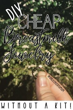 a hand holding a ring with the words, my cheap breast milk jewelry without a kit