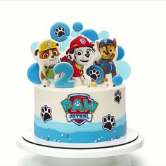 a birthday cake with paw patrol characters on it