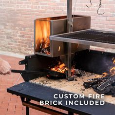 a grill with flames burning in it and the words custom fire brick included