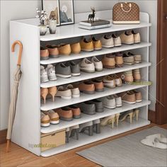 a white shoe rack filled with lots of shoes