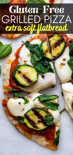 grilled pizza with zucchini, cheese and spinach leaves on the side