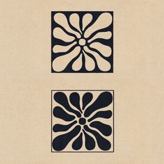 two black and white designs on beige paper